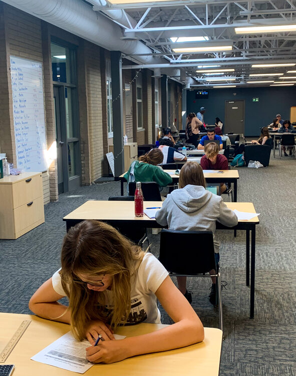 Students studying at desks in the Learning Commons