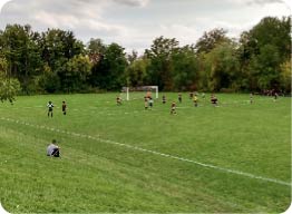 students on sports playing field