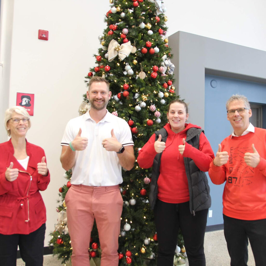 Happy teachers with thumbs up.